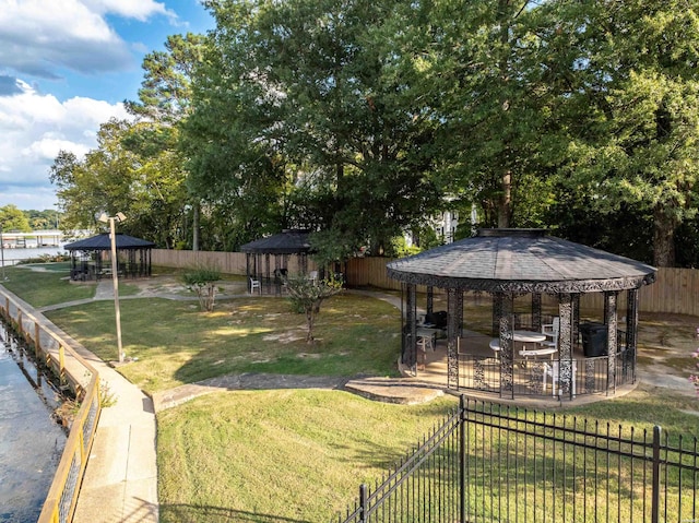 view of yard featuring fence and a gazebo