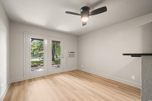 183 River Mill Ct Unit B-1, Hot Springs, AR 71913 - unfurnished room featuring light wood-style flooring, ceiling fan, and a wall mounted air conditioner