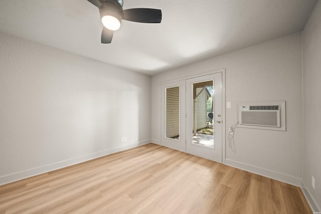 183 River Mill Ct Unit B-1, Hot Springs, AR 71913 - empty room with an AC wall unit, wood finished floors, and a ceiling fan