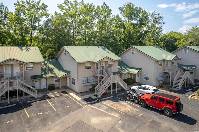 183 River Mill Ct Unit B-1, Hot Springs, AR 71913 - view of building exterior featuring stairway and uncovered parking