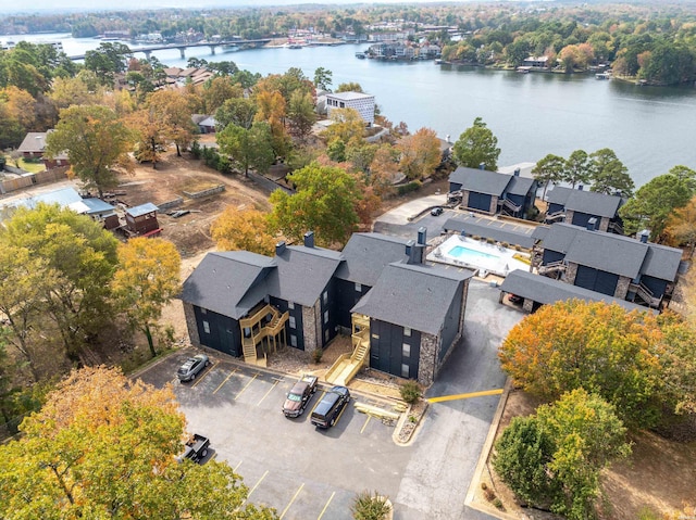 birds eye view of property with a water view