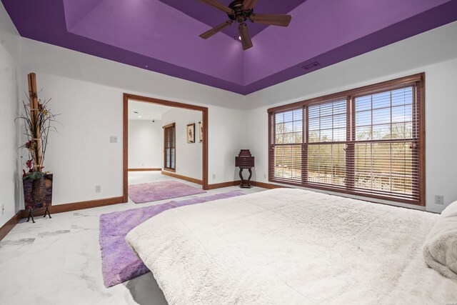 bedroom with marble finish floor, visible vents, baseboards, and a ceiling fan