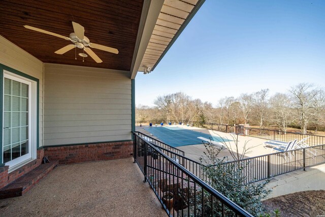 balcony with a patio and ceiling fan