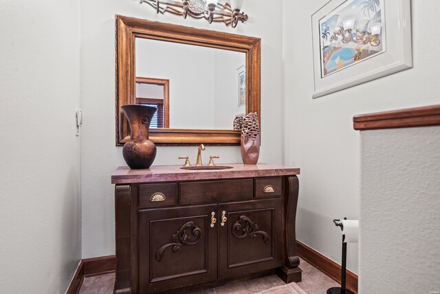 interior space featuring vanity and baseboards