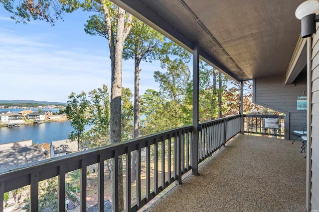 balcony featuring a water view