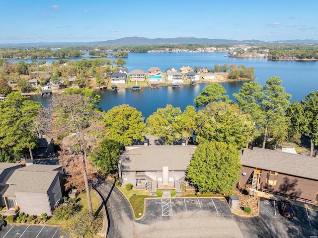 drone / aerial view with a residential view and a water and mountain view