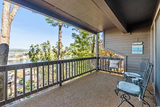 balcony featuring a water view