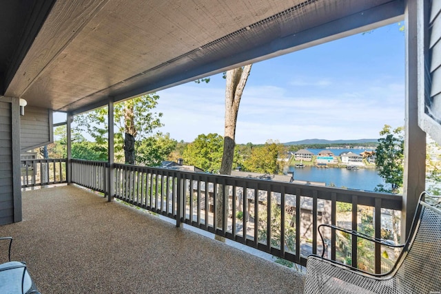 balcony featuring a water view