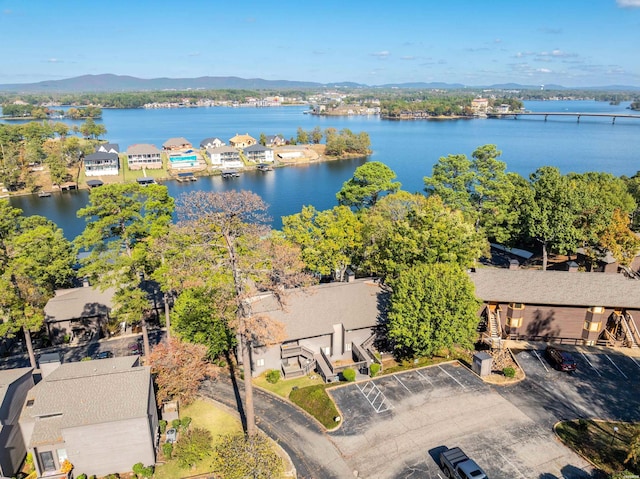 drone / aerial view featuring a residential view and a water and mountain view