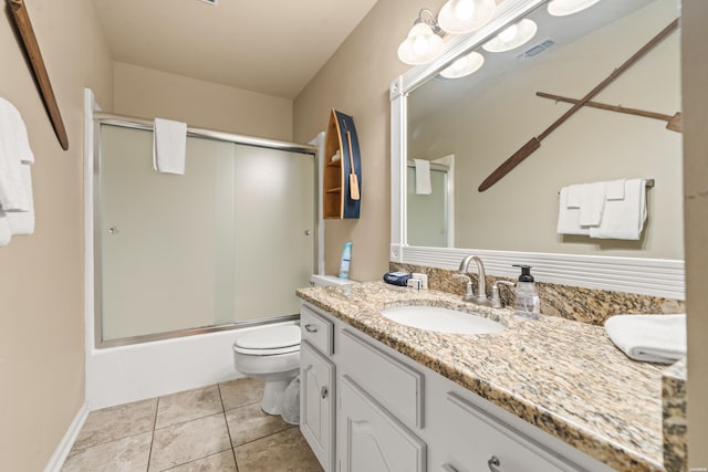 bathroom featuring visible vents, toilet, enclosed tub / shower combo, tile patterned flooring, and vanity