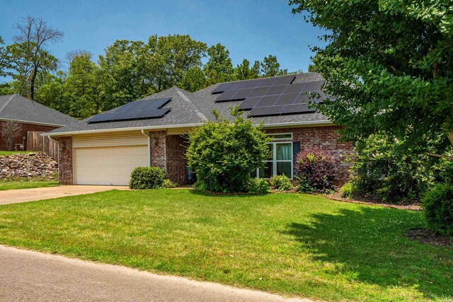 114 Cliffwood Loop, Hot Springs, AR 71913 - view of front of property with brick siding, an attached garage, a front lawn, driveway, and solar panels