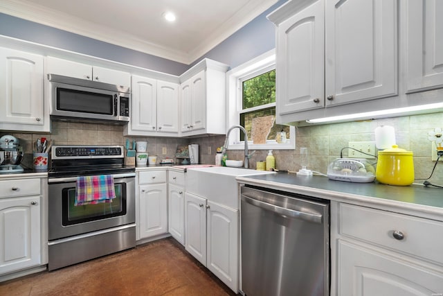 114 Cliffwood Loop, Hot Springs, AR 71913 - kitchen with appliances with stainless steel finishes, white cabinets, ornamental molding, decorative backsplash, and a sink