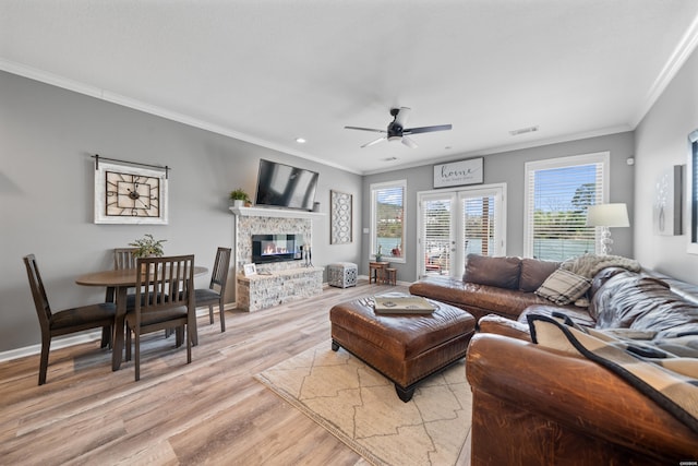 128 Kaleigh Ct Unit B, Hot Springs, AR 71913 - living area featuring crown molding, light wood-style floors, ceiling fan, a fireplace, and baseboards