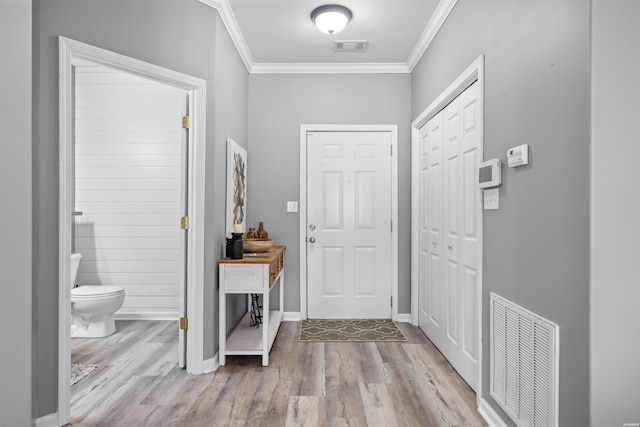 128 Kaleigh Ct Unit B, Hot Springs, AR 71913 - entrance foyer featuring ornamental molding, wood finished floors, and baseboards