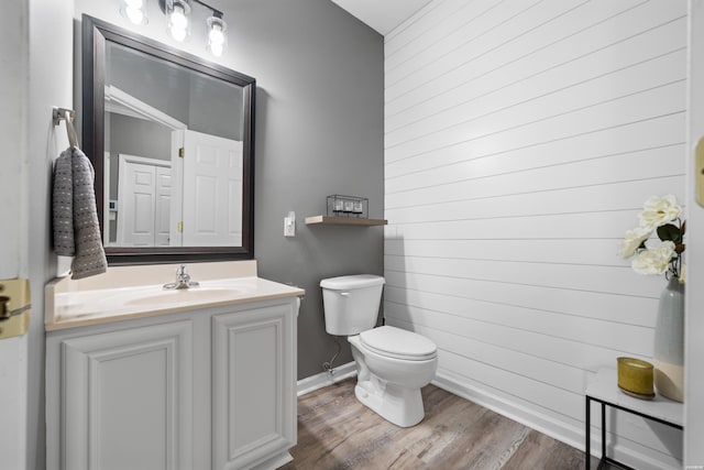 128 Kaleigh Ct Unit B, Hot Springs, AR 71913 - bathroom featuring toilet, vanity, wood finished floors, baseboards, and wooden walls