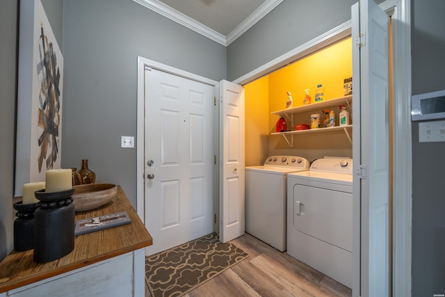128 Kaleigh Ct Unit B, Hot Springs, AR 71913 - washroom featuring ornamental molding, separate washer and dryer, and light wood-type flooring