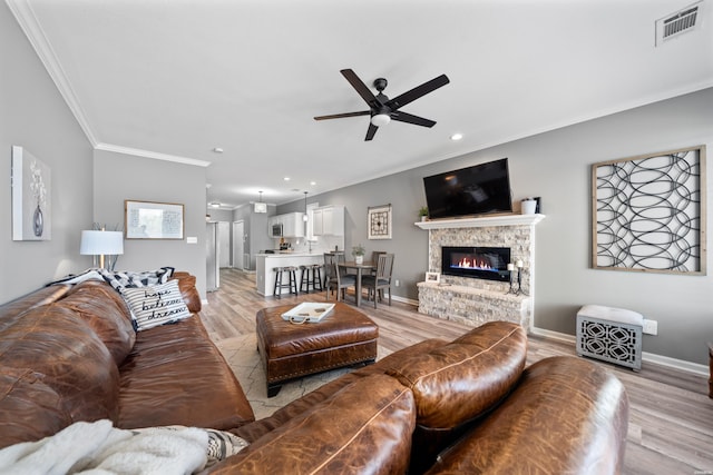 128 Kaleigh Ct Unit B, Hot Springs, AR 71913 - living area with ornamental molding, a ceiling fan, light wood-type flooring, recessed lighting, and a fireplace