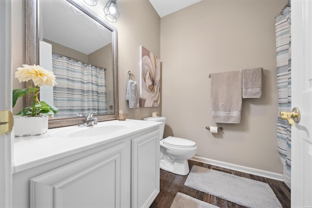 128 Kaleigh Ct Unit B, Hot Springs, AR 71913 - full bath with toilet, vanity, wood finished floors, and baseboards