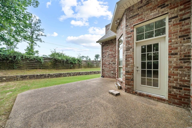 view of patio featuring fence
