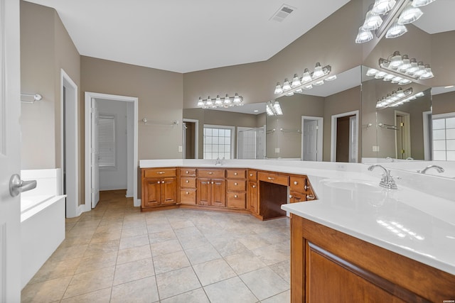 full bath featuring tile patterned flooring, visible vents, a sink, and double vanity