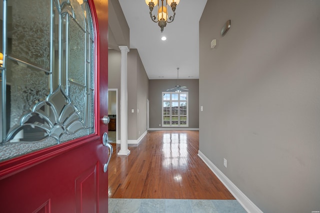 foyer entrance with decorative columns, baseboards, ceiling fan, wood finished floors, and recessed lighting