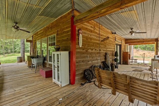 deck featuring a ceiling fan and french doors