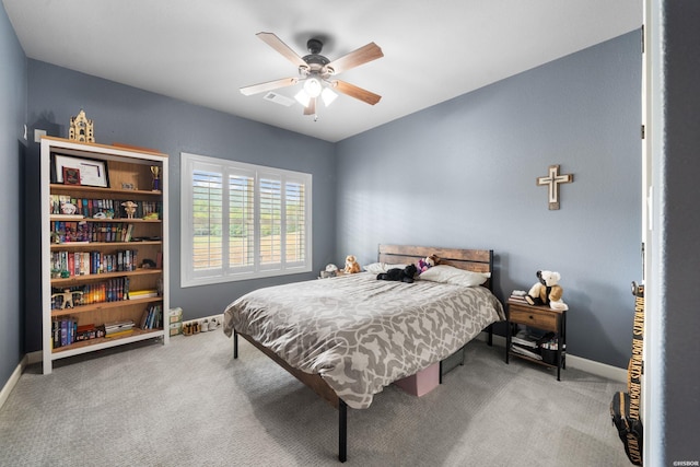 bedroom with visible vents, carpet flooring, a ceiling fan, and baseboards