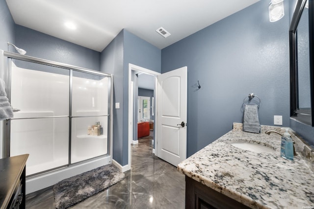 bathroom with visible vents, baseboards, marble finish floor, vanity, and a shower stall