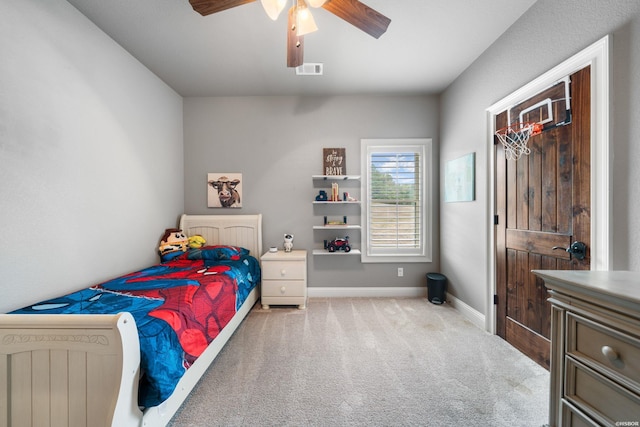 carpeted bedroom featuring baseboards, visible vents, and ceiling fan