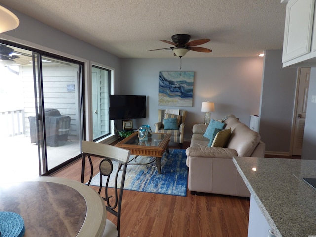 400 Farr Shores Dr Unit 2E, Hot Springs, AR 71913 - living area with a ceiling fan, wood finished floors, and a textured ceiling