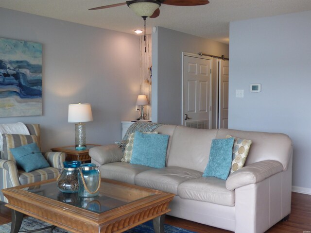400 Farr Shores Dr Unit 2E, Hot Springs, AR 71913 - living area featuring a ceiling fan, wood finished floors, a barn door, and baseboards