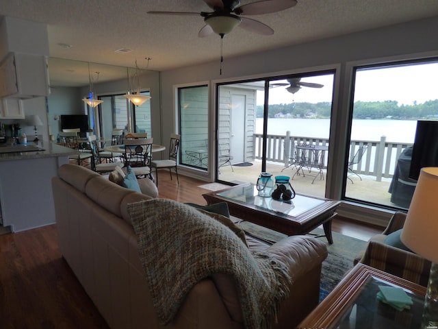 400 Farr Shores Dr Unit 2E, Hot Springs, AR 71913 - living room with a ceiling fan, wood finished floors, and a textured ceiling