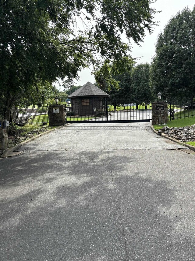 view of gate featuring fence