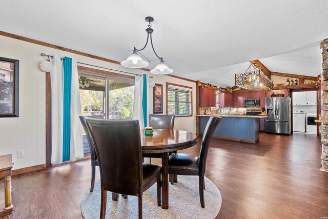 dining room with lofted ceiling, dark wood-style floors, and baseboards