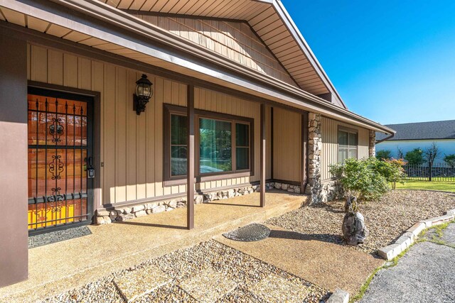 property entrance with covered porch