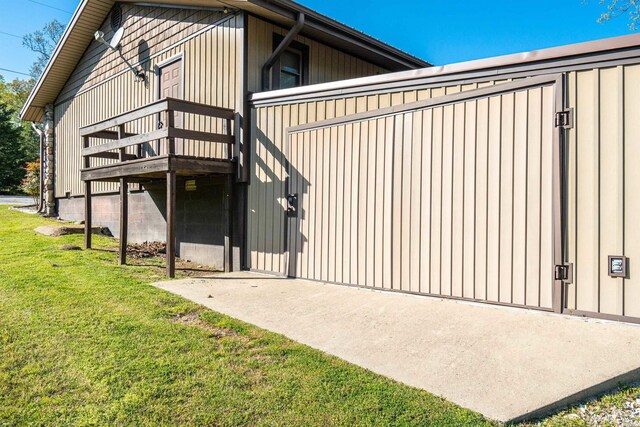 exterior space featuring a lawn and a deck