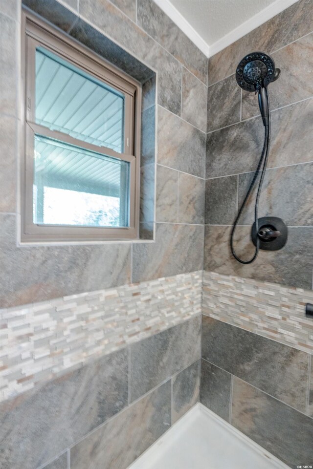 full bath with a tile shower