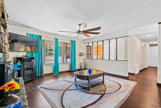 living room featuring ceiling fan, a textured ceiling, wine cooler, visible vents, and dark wood-style floors