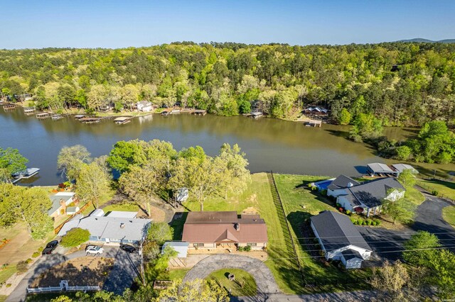 birds eye view of property featuring a water view, a residential view, and a view of trees