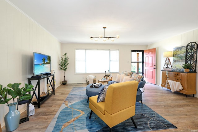 1405 Emory St, Hot Springs, AR 71913 - living room featuring healthy amount of natural light, light wood-style flooring, crown molding, a chandelier, and baseboards