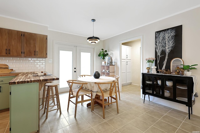1405 Emory St, Hot Springs, AR 71913 - dining space with ornamental molding, french doors, and light tile patterned floors