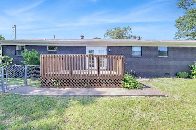 1405 Emory St, Hot Springs, AR 71913 - back of house featuring brick siding, a deck, crawl space, and a gate