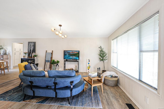 1405 Emory St, Hot Springs, AR 71913 - living area featuring wood finished floors and a chandelier