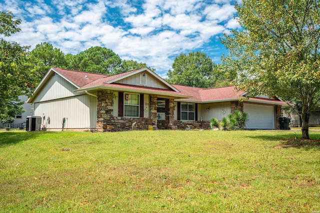 ranch-style house with stone siding, cooling unit, a front lawn, and a garage