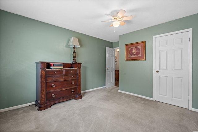 bedroom featuring carpet and baseboards