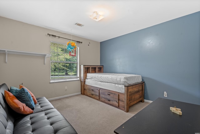 bedroom featuring visible vents, baseboards, and carpet floors