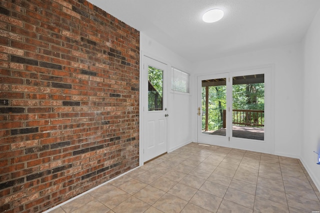1200 Rock Creek Rd, Hot Springs, AR 71913 - tiled entrance foyer featuring brick wall