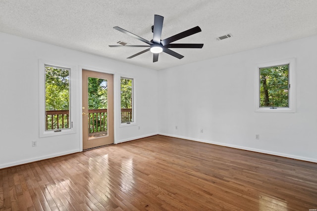 1200 Rock Creek Rd, Hot Springs, AR 71913 - spare room with hardwood / wood-style flooring, ceiling fan, baseboards, and a textured ceiling