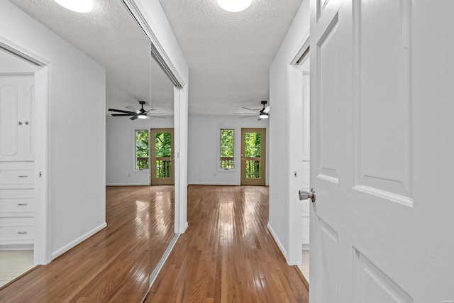 1200 Rock Creek Rd, Hot Springs, AR 71913 - corridor with light wood-type flooring, baseboards, and a textured ceiling