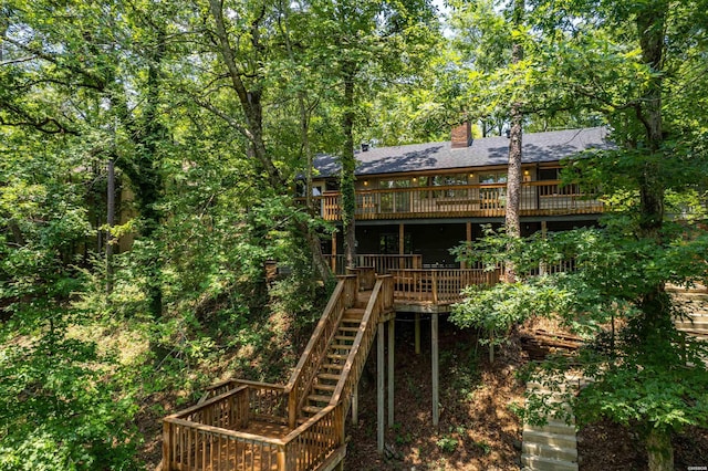1200 Rock Creek Rd, Hot Springs, AR 71913 - back of property featuring stairway, a wooden deck, roof with shingles, and a chimney
